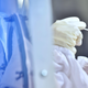 A residents of the Klong Toey community has a nasal swab sample taken by medical workers during testing for the COVID-19 novel coronavirus in Bangkok on May 6, 2020.
